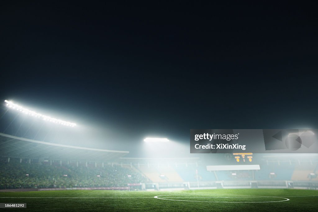 Digital coposit of soccer field and night sky