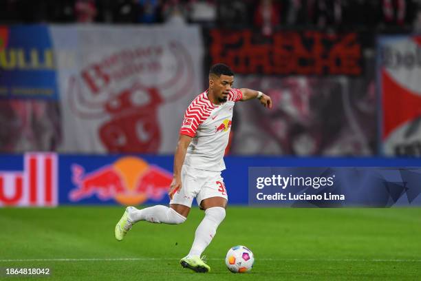 Benjamin Henrichs of RB Leipzig in action during the Bundesliga match between RB Leipzig and TSG Hoffenheim at Red Bull Arena on December 16, 2023 in...