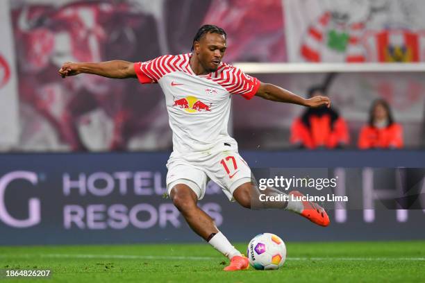 Lois Openda of RB Leipzig in action during the Bundesliga match between RB Leipzig and TSG Hoffenheim at Red Bull Arena on December 16, 2023 in...
