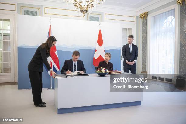 Jeremy Hunt, UK chancellor of the exchequer, second left, and Karin Keller-Sutter, Switzerland's finance minister, second right, during a news...