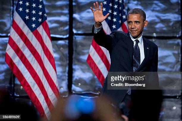 President Barack Obama waves after speaking at the SelectUSA 2013 Investment Summit in Washington, D.C., U.S., on Thursday, Oct. 31, 2013. The summit...