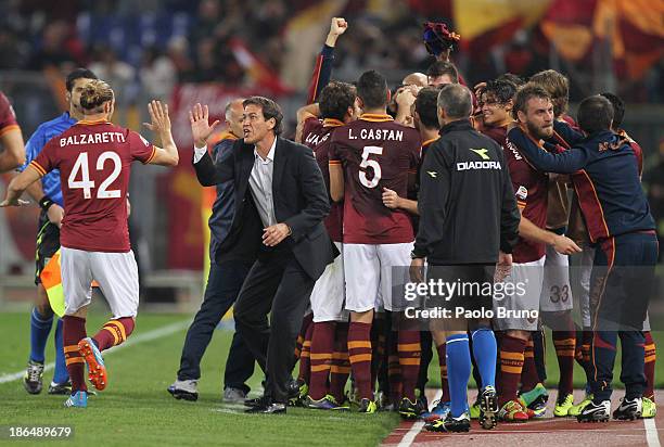 Roma head coach Rudi Garcia with his players celebrates the opening goal scored by Marco Borriello during the Serie A match between AS Roma and AC...