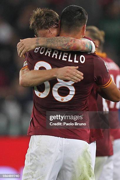 Marco Borriello of AS Roma celebrates after scoring the opening goal with his team mate Daniele De Rossi during the Serie A match between AS Roma and...