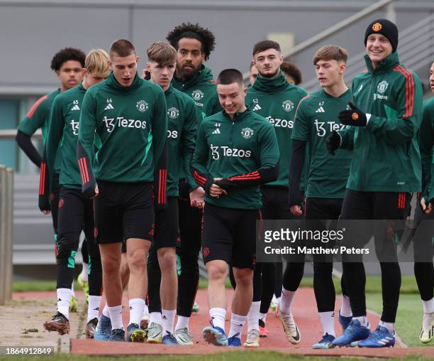 Rhys Bennett, Dan Gore, Joe Hugill, Donny van de Beek of Manchester United in action during a first team training session at Carrington Training...