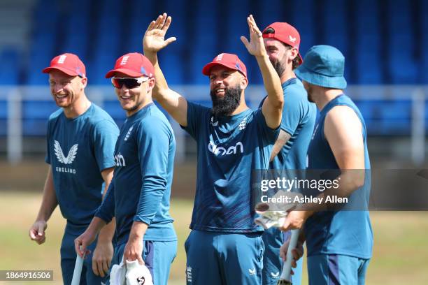 Moeen Ali of England enjoys himself during an England Net Session ahead of the 4th T20 International at Queens Park Oval on December 18, 2023 in Port...