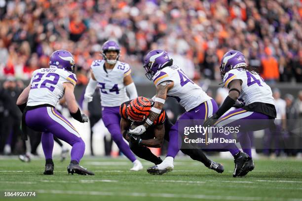 Ja'Marr Chase of the Cincinnati Bengals is tackled by Ivan Pace Jr. #40 of the Minnesota Vikings after making a catch during a NFL football game at...