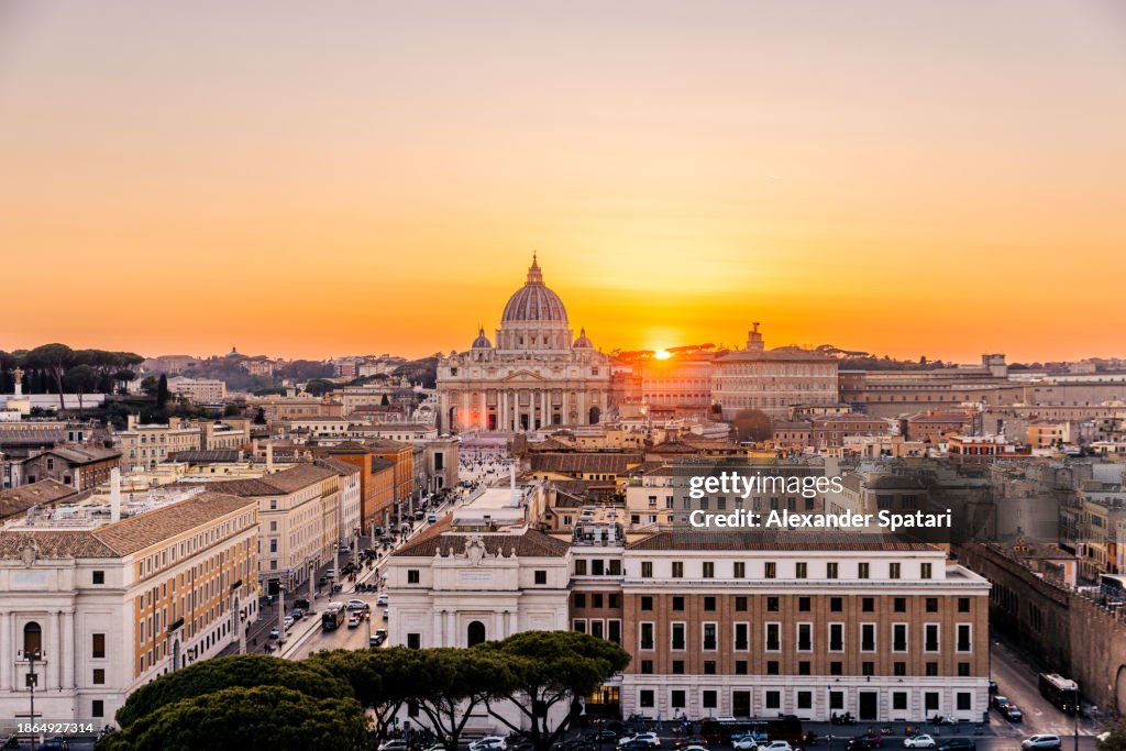Aerial panoramic view of Rome skyline with St. Peter's Basilica at sunset, Italy
