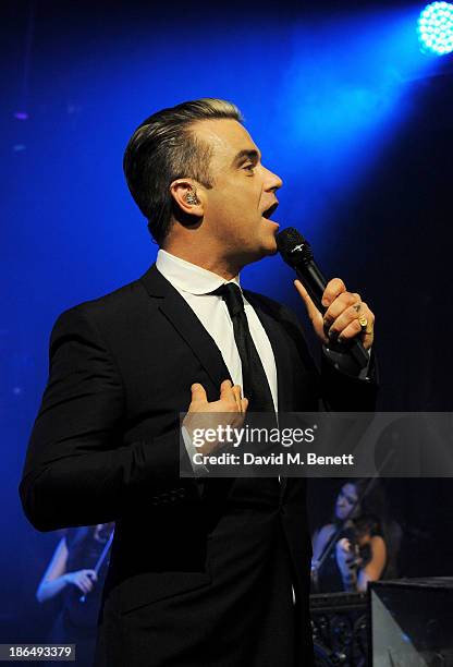 Robbie Williams performs at the UNICEF UK Halloween Ball hosted by Jemima Khan, raising vital funds for UNICEF's work for children affected by the...