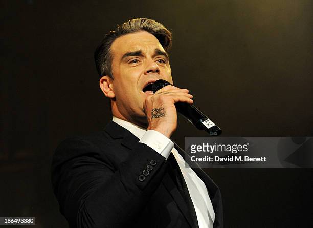 Robbie Williams performs at the UNICEF UK Halloween Ball hosted by Jemima Khan, raising vital funds for UNICEF's work for children affected by the...