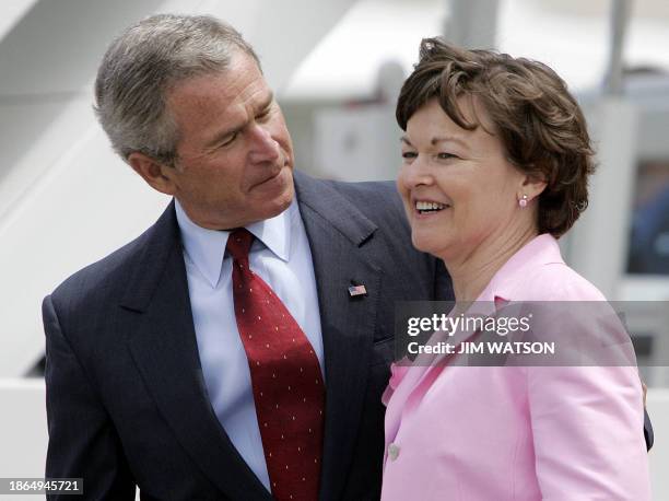 President George W. Bush is greeted by breast cancer survivor Dorothy Paterson at Ellington Feild in Houston, Texas, before traveling to Galveston,...