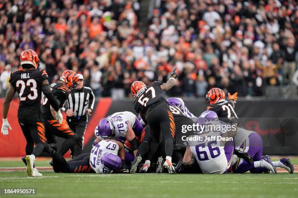 Cincinnati Bengals players react after a fourth down stop during overtime in a NFL football game against the Minnesota Vikings at Paycor Stadium on...