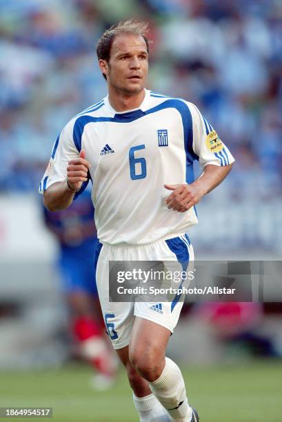 June 25: Angelis Basinas of Greece running during the UEFA Euro 2004 Quarter Final match between France and Greece at Jose Alvalade Stadium on June...