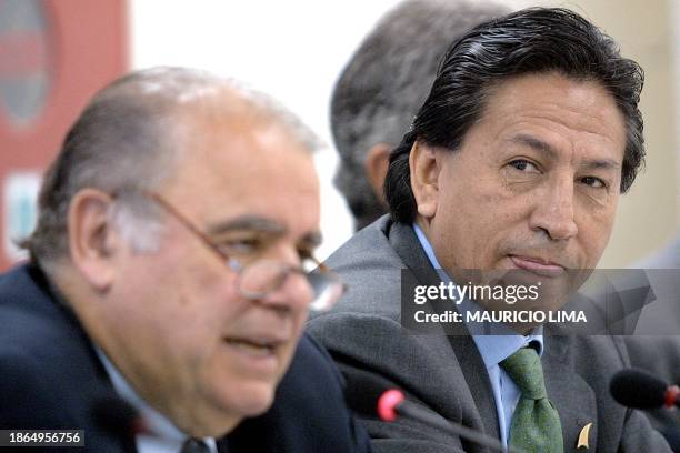 Enrique Iglesias gives a speech as Alejandro Toledo, president of Peru listens 10 March 2002, during the 43rd annual assembly of the Inter-American...