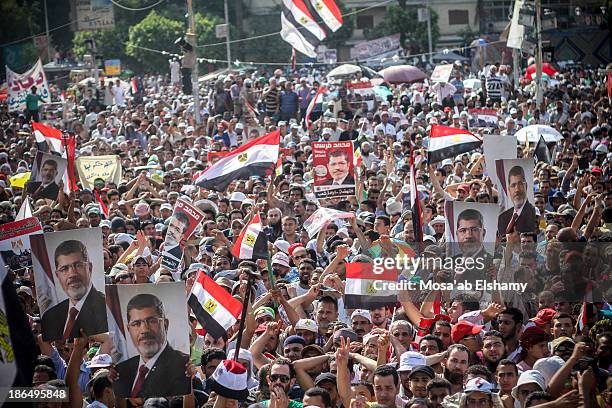 Supporters of ousted president Mohamed Morsi are seen in Rabaa Adaweya camp where they called for his return after the military coup that ousted him...