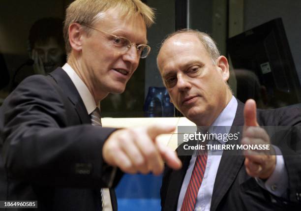 New incoming European commissioner for Science and Research Slovenian Janez Potocnik gestures as he talks with chairman of the committee on Industry,...