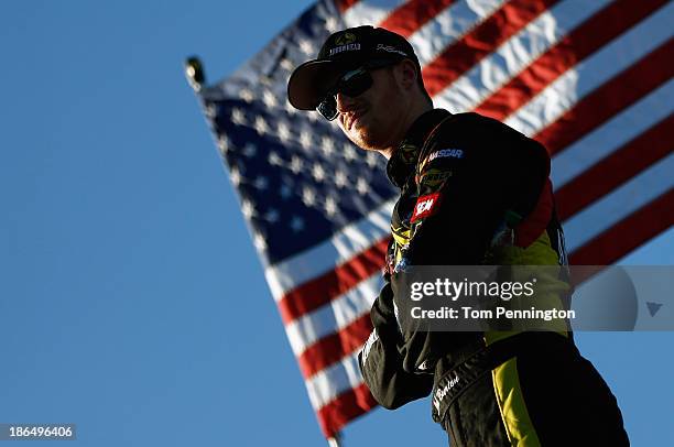 Jeb Burton, driver of the Arrowhead Chevrolet, looks on in the garge area during practice for the NASCAR Camping World Truck Series WinStar World...