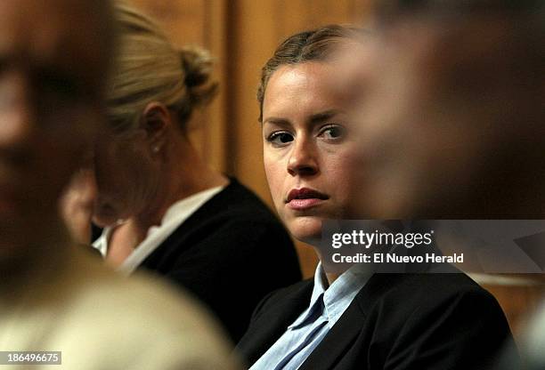 Sean Taylor's girlfriend, Jackie Garcia Haley, listens as Judge Dennis Murphy wraps up court for the day, after the jury finished a full day of...