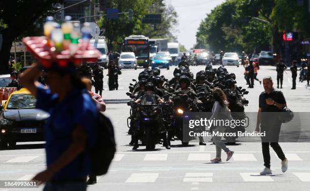 Police officers on motorcycles patrol during a demonstration against President Javier Milei and recent announcements by Minister of Economy Luis...