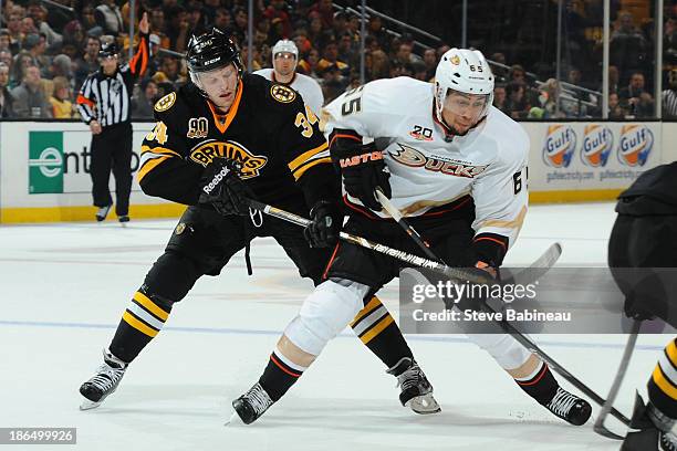 Emerson Etem of the Anaheim Ducks battles for the puck against Carl Soderberg of the Boston Bruins at the TD Garden on October 31, 2013 in Boston,...