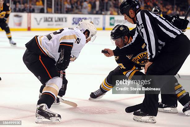 Patrice Bergeron of the Boston Bruins gets set for a faceoff against Mathieu Perreault of the Anaheim Ducks at the TD Garden on October 31, 2013 in...