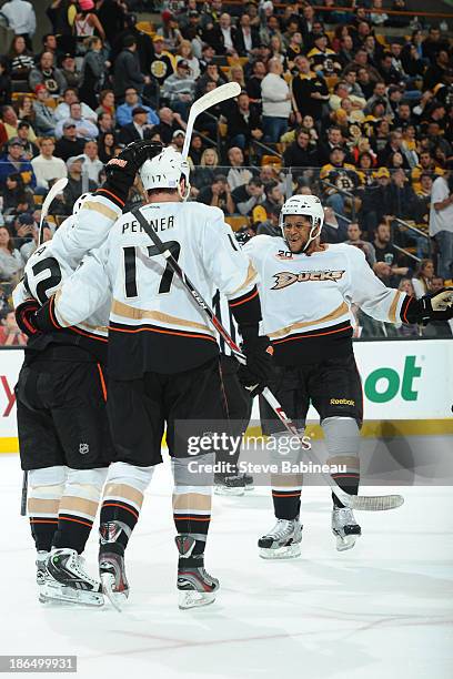 Players of the Anaheim Ducks celebrate a goal against the Boston Bruins at the TD Garden on October 31, 2013 in Boston, Massachusetts.