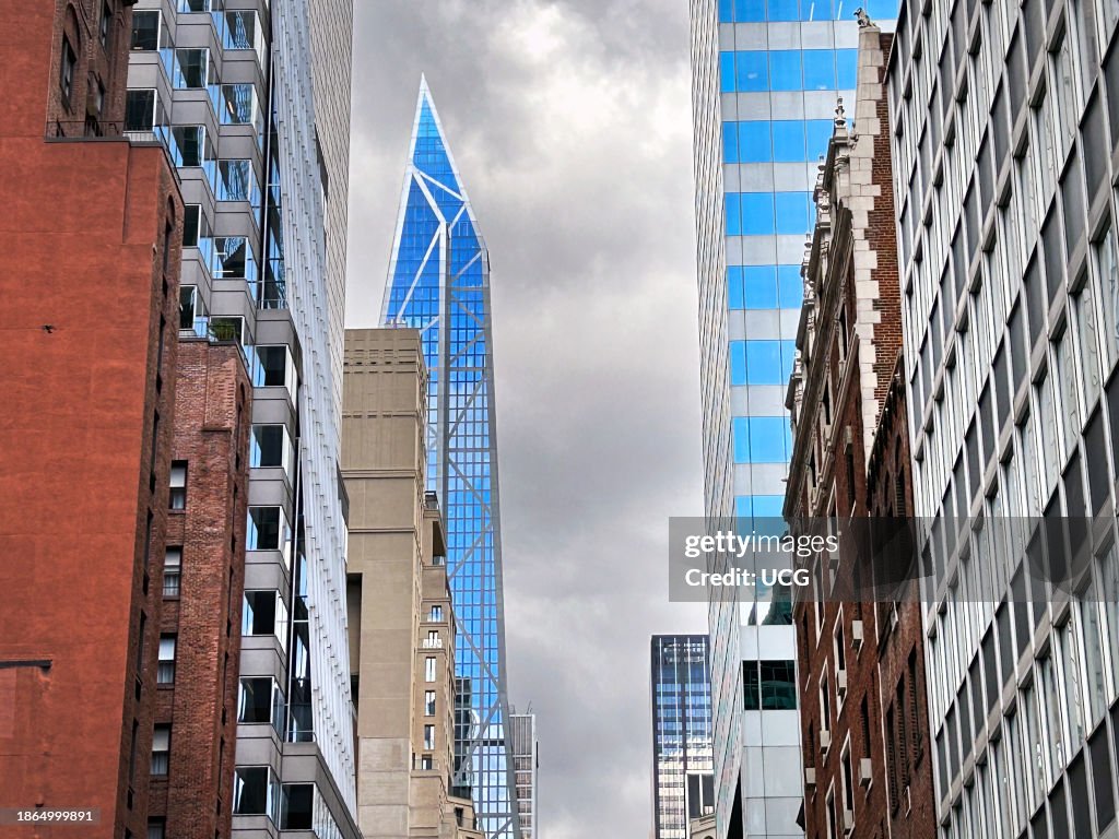 Cityscape featuring 53W53 skyscraper with grey sky, New York City, New York, USA