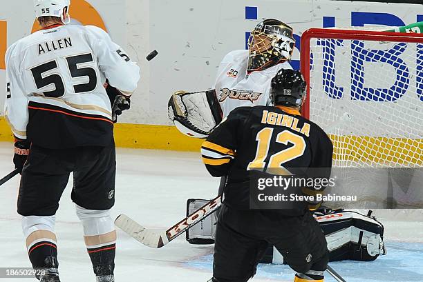 Jonas Hiller of the Anaheim Ducks watches the incoming puck against the Boston Bruins at the TD Garden on October 31, 2013 in Boston, Massachusetts.