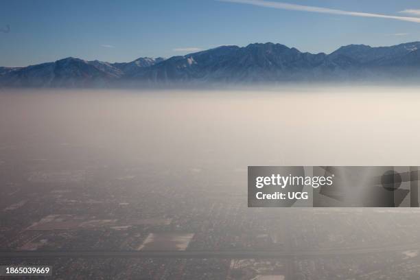 Aerial view of Atmospheric inversion against the Wasatch Mountains, Salt Lake City, Utah.