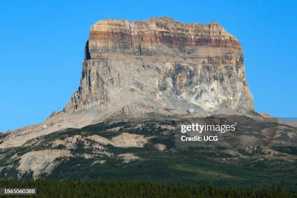 Chief Mountain, a klippe of Proterozoic rock of the Belt Supergroup emplaced by the Lewis Thrust over Cretaceous rock , Glacier National Park,...