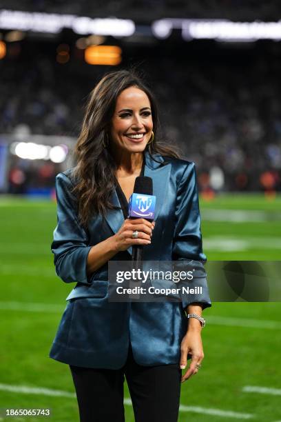 Kaylee Hartung looks on from the sideline prior to an NFL football game between the Los Angeles Chargers and the Las Vegas Raiders at Allegiant...