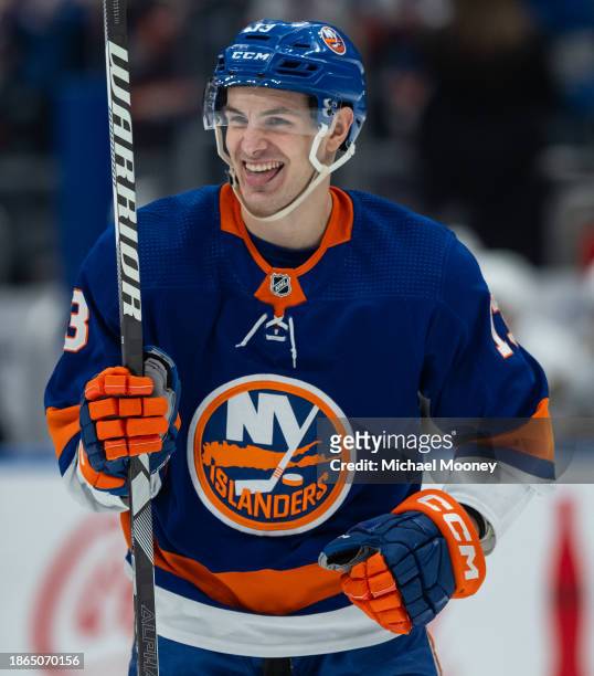 Mathew Barzal of the New York Islanders reacts to a second period goal by Alexander Romanov during a game against the Boston Bruins at UBS Arena on...