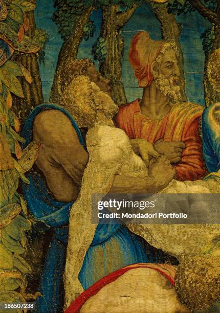 Italy, Lombardy, Milan, Duomo Museum, Detail, In a garland of leaves and snakes two men are sustening an idolatrous.