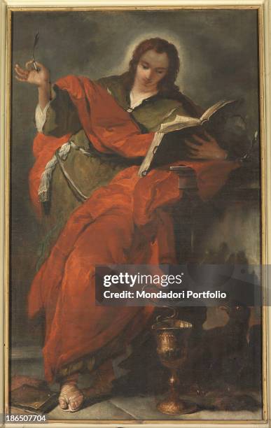 Italy, Veneto, Belluno, Duomo, Whole artwork view, The apostle holding a pen and a book, probably in the act of writing a Gospel passage, In the...