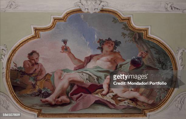 Italy, Lombardy, Bergamo, palace Agliardi, Whole artwork view, Grapes and barrels surround the God Bacchus drinking red wine from a glass together...