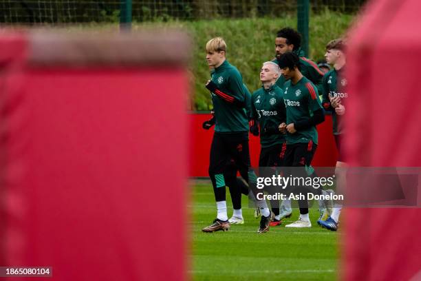 Toby collyer, Isak Hansen-Aaroen, Maxi Oyedele and Tom Huddlestone of Manchester United in action during a first team training session at Carrington...