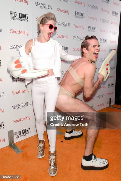 Julie Macklowe and blogger Perez Hilton attend the 2013 Heidi Klum Halloween Party at Marquee on October 31, 2013 in New York City.