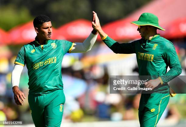 Beuran Hendricks of South Africa celebrates with teammates after getting the wicket of Washington Sundar of India during the 3rd One Day...