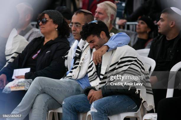 Family and Friends mourn during the funeral of IDF Staff Sgt. Levi Gihassi on December 21, 2023 in Modi'in, Israel. IDF announced the death of 19...