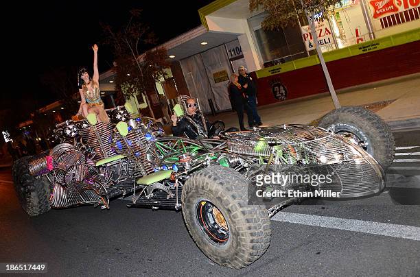 Model and parade queen Claire Sinclair is driven by Henry Chang in the MisterFusion Artcar during the fourth annual Las Vegas Halloween Parade on...