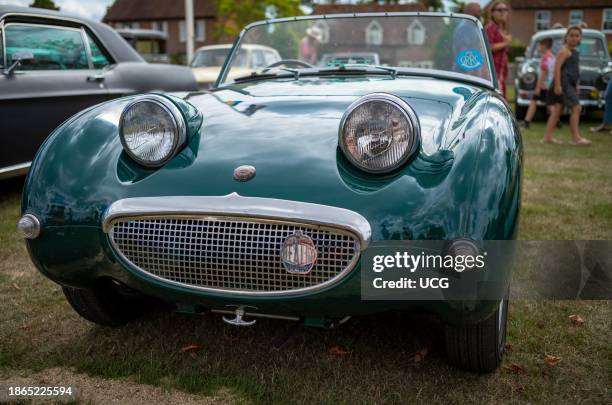 Vintage Austin Healey "Frogeye" Sprite sports car on display at Wisborough Green Village Fete in West Sussex, UK.