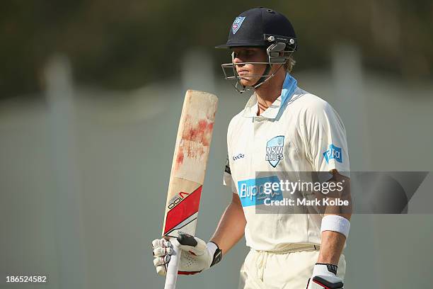 Steve Smith of the Blues acknowledges the crowd as leaves the field after being dismissed during day three of the Sheffield Shield match between the...
