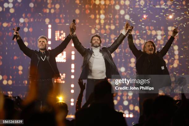Take That perform onstage during the finale of The National Lottery's Big Bash to celebrate 2023 at OVO Arena Wembley on December 06, 2023 in London,...