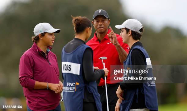 Tiger Woods, Charlie Woods and Sam Woods of the United States during the final round of the PNC Championship at The Ritz-Carlton Golf Club on...