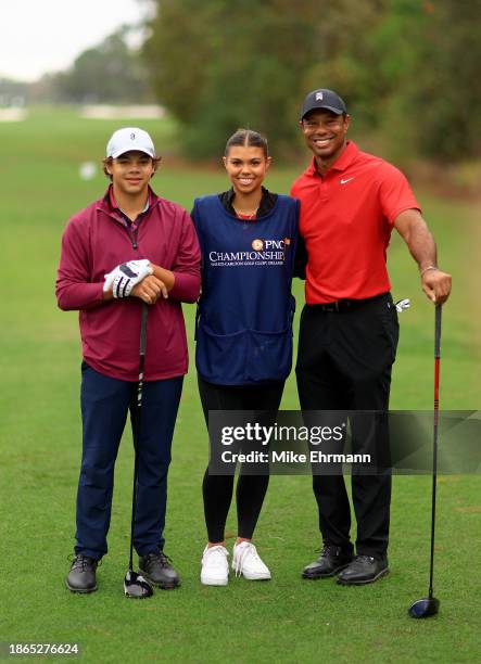 Tiger Woods, Charlie Woods and Sam Woods of the United States during the final round of the PNC Championship at The Ritz-Carlton Golf Club on...