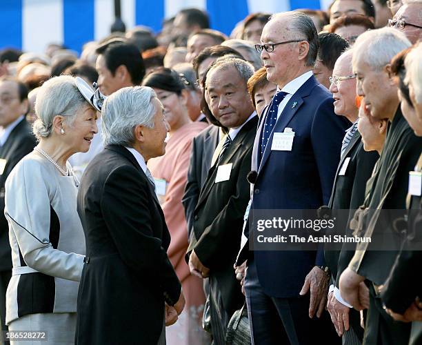 Emperor Akihito and Empress Michiko greet Shigeo Nagashima during the Autumn Imperial Garden Party on October 31, 2013 in Tokyo, Japan.