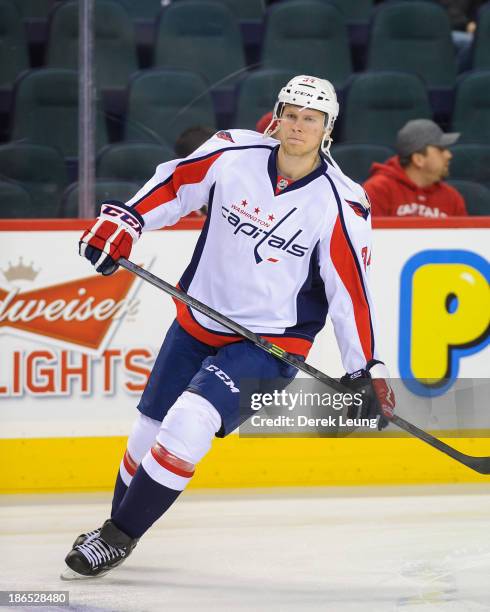 Alexander Urbom of the Washington Capitals skates against the Calgary Flames during an NHL game at Scotiabank Saddledome on October 26, 2013 in...