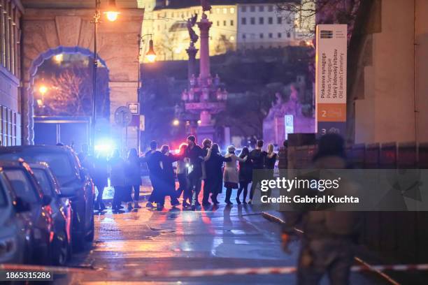 Students of Charles University are being evacuated by police at the location of the shooting on December 21, 2023 in Prague, Czech Republic. A...