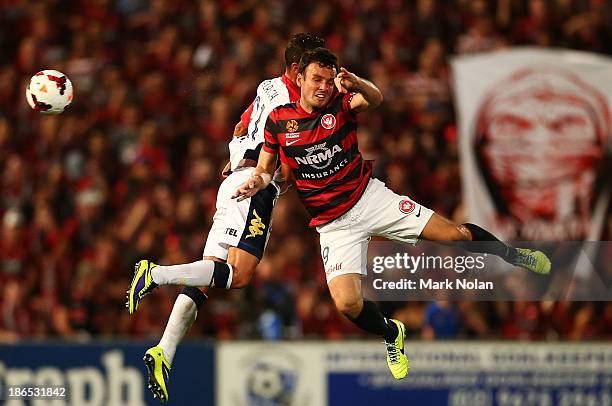 Tarek Elrich of Adelaide and Mark Bridge of the Wanderers contest possession during the round four A-League match between the Western Sydney...