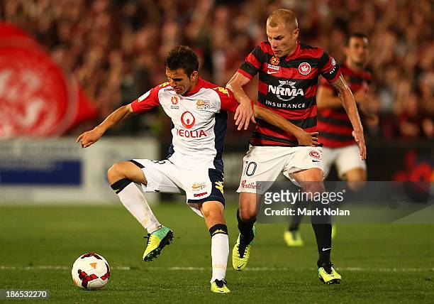 Isaias Sanchez of Adelaide controls the ball as Aaron Mooy of the Wanderers defends during the round four A-League match between the Western Sydney...