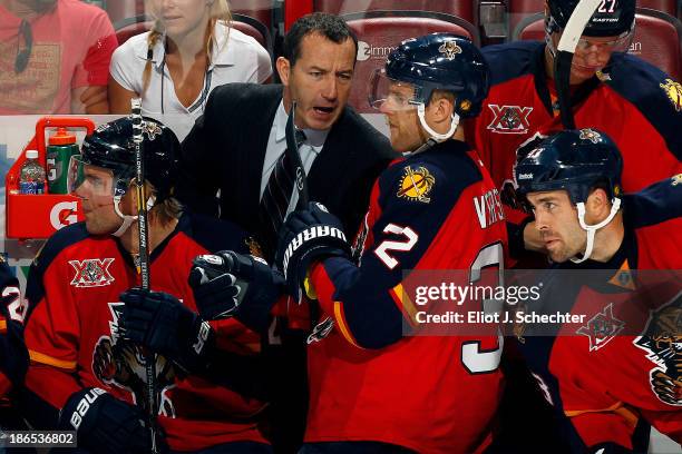 Head Coach Kevin Dineen of the Florida Panthers directs Kris Versteeg during a break in the action against the Tampa Bay Lightning at the BB&T Center...